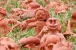 Clay figures in a yard.